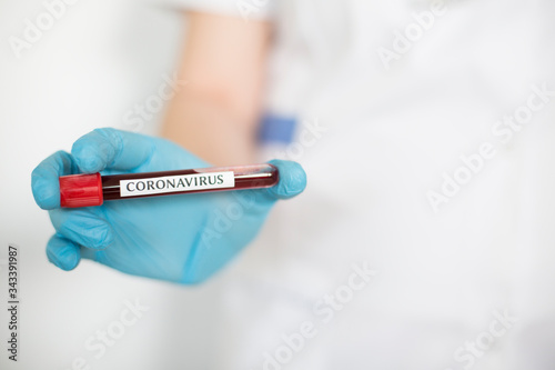 Doctor holding blood test for 2019-nCoV .Pandemic novel Coronavirus concept