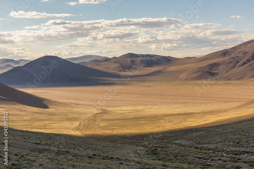 Dry Mongolian landscapes in the Altai Mountains, wide landscape. Yurt camp