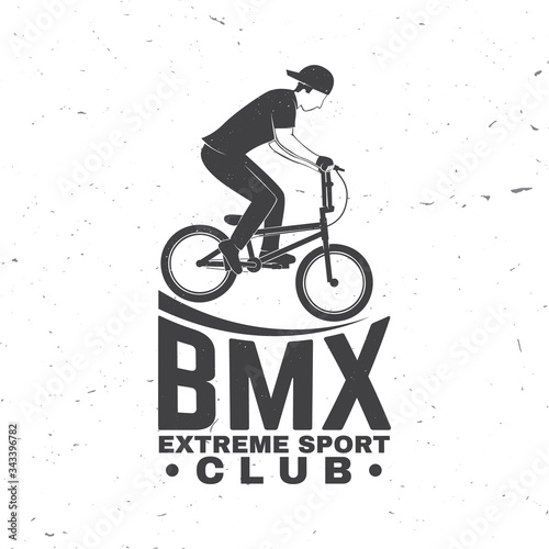 Bmx extreme sport club badge. Vector. Concept for shirt, logo, print, stamp, tee with man ride on a sport bicycle. Vintage typography design with bmx cyclist silhouette.