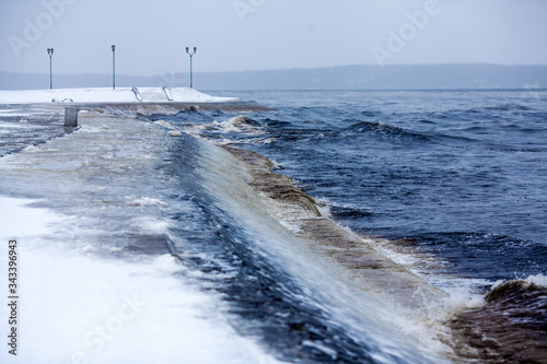 Petrozavodsk, Karelia. Embankment of Lake Onega in winter. Winter storm on a deserted promenade