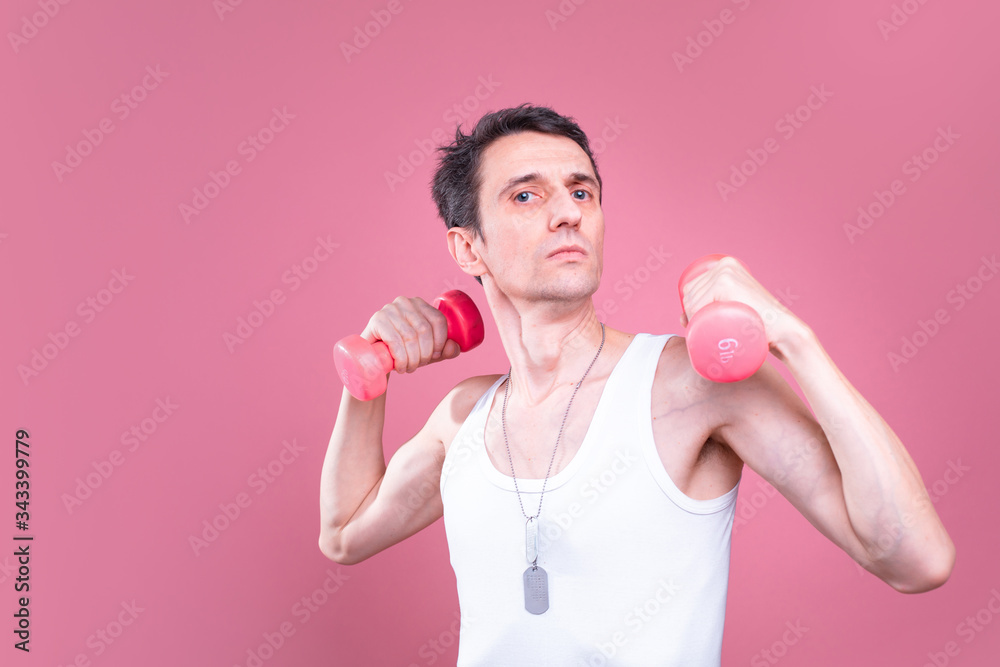 Funny, pale skinny young man isolated over pink background. Side view of confident guy pose on camera. Alone in studio. Funny, pale skinny young man isolated over pink background. Side view of confident guy pose on camera. Alone in studio.