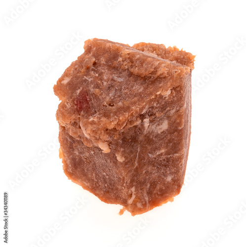 a large piece of frozen minced meat on a white background