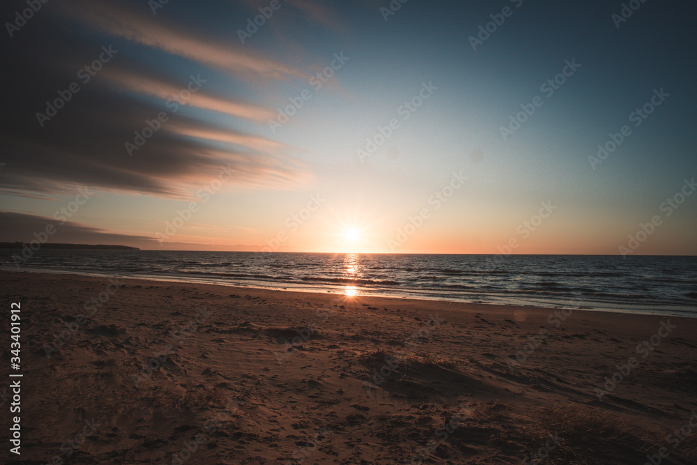 sunset on the beach at baltic sea sunset on the beach at baltic sea