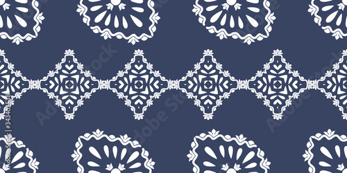 White ornament on blue seamless pattern. Vintage, paisley elements. Ornamental traditional, ethnic, turkish. Great for fabric and textile, wallpaper, packaging or any idea.