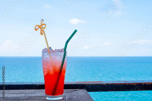 Cold punch water drink With a backdrop of beautiful sea views Suitable for drinking in a glass. Watching the view on holidays Of travel.