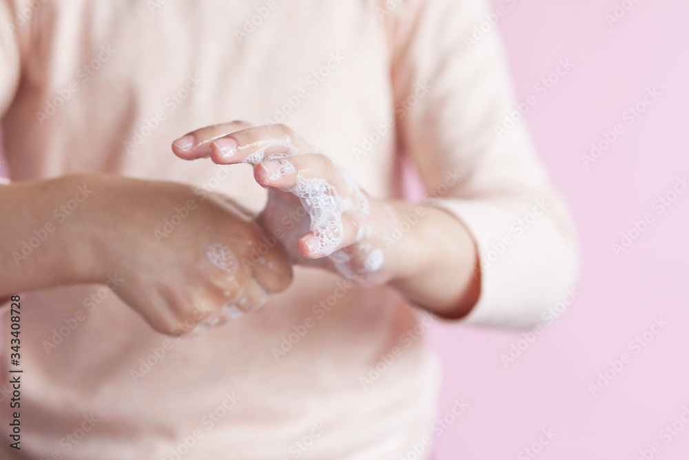 Child girl cleaning hands with soap. Hand disinfection. Epidemic Covid-19. Child girl cleaning hands with soap. Hand disinfection. Epidemic Covid-19.