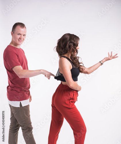 Beauty couple dancing social dance. Kizomba or bachata or semba or taraxia , on white background. Social dance concept. photo