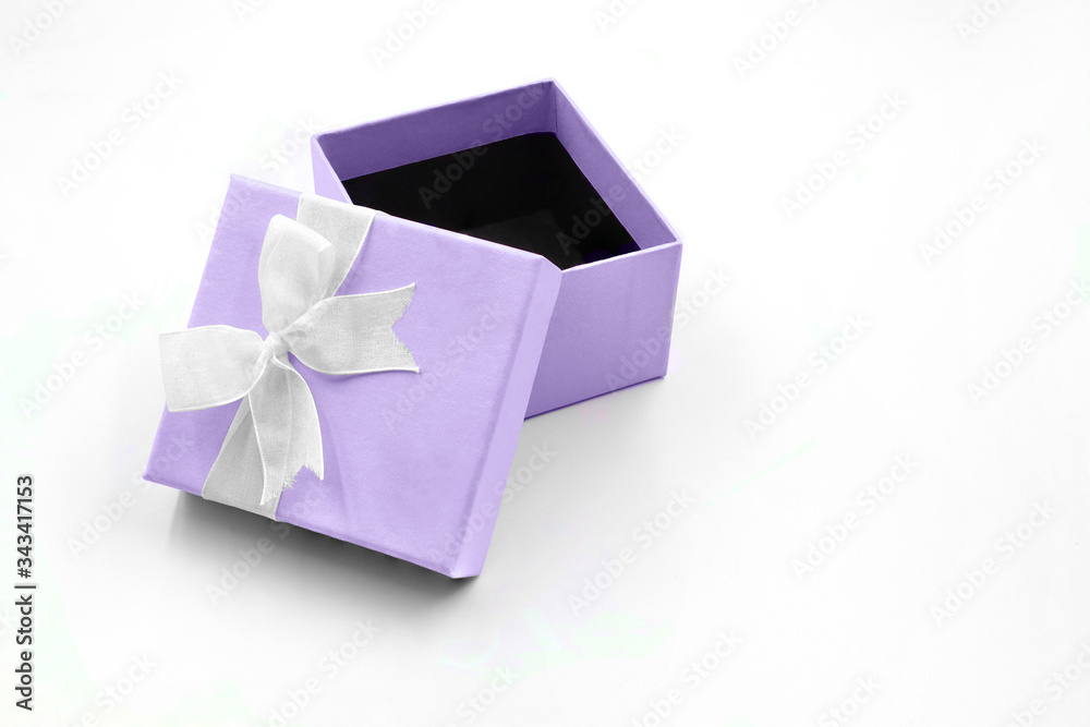light purple gift box with ribbon on white background light purple gift box with ribbon on white background