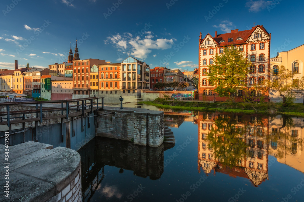 Obraz premium Spring view of city Opole in Silesia in Poland. Historical old town in gold light.