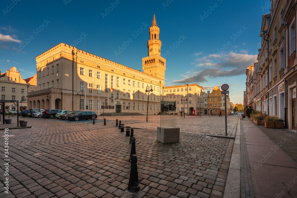 Naklejka premium Spring view of city Opole in Silesia in Poland. Historical old town in gold light.