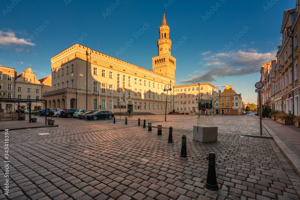 Naklejka premium Spring view of city Opole in Silesia in Poland. Historical old town in gold light.