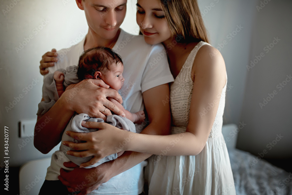Newborn baby with mom and dad at home
Newborn baby with mom and dad at home