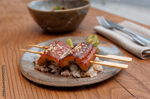 Fotografie Unagi eel with rice on table