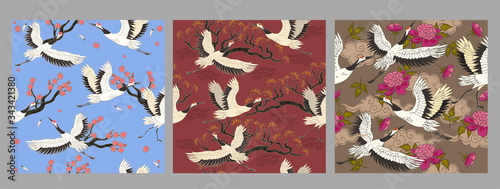 Collection of seamless patterns with cranes birds. Vector graphics.