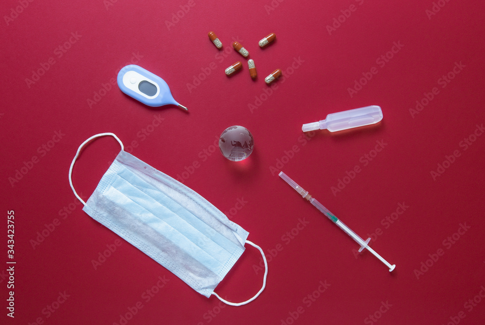 Concept of new Coronavirus -Covid 2019 with medicines and World globe.Top view. Concept of new Coronavirus -Covid 2019 with medicines and World globe.Top view.
