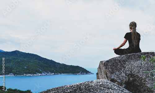 Serenity and yoga practicing by the sea with island view, meditation