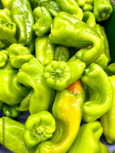 Bright green bell pepperoncinis in a pile