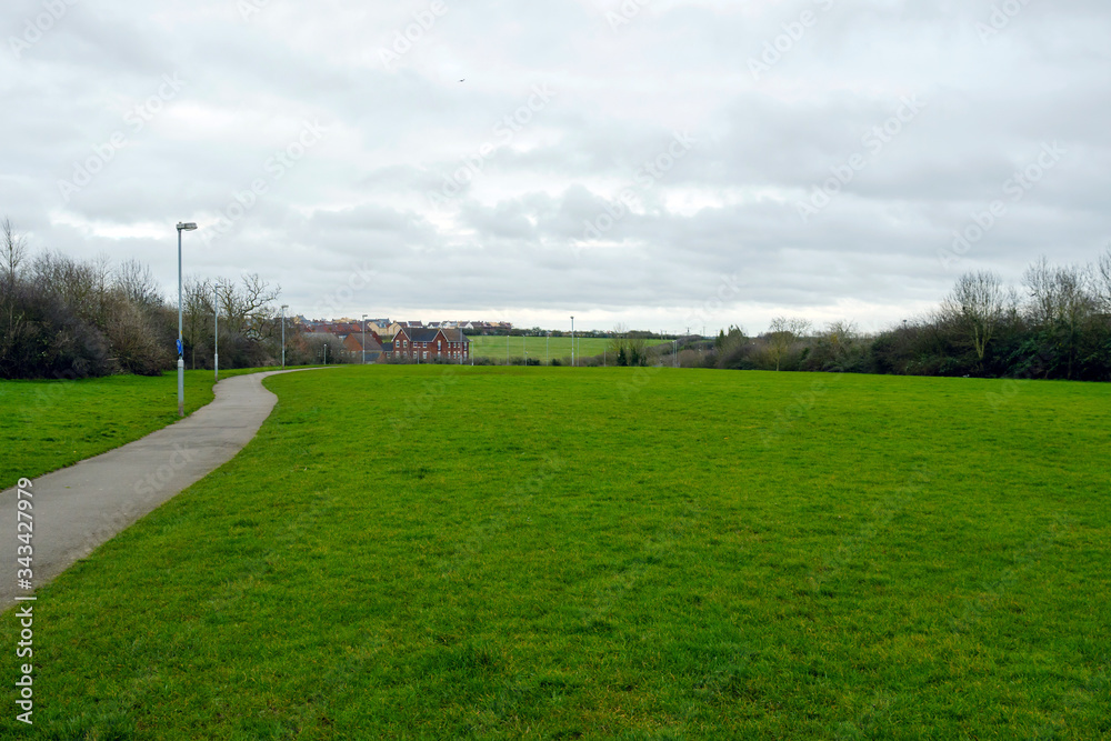 empty green field next footpath in england uk during coronavirus covid 19 lockdown