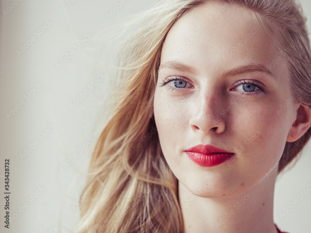 Fototapeta premium Blonde hair woman model red lipstick lips beauty portrait
