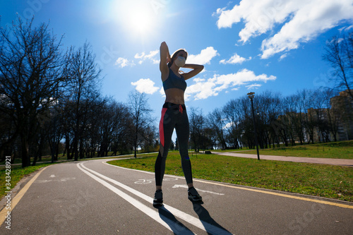 Woman runners morning exercise she wears a nose mask. Protection against dust and viruses