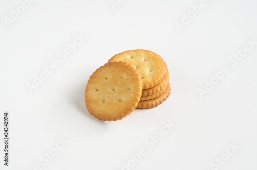 Crispy cookies or crackers on white background.