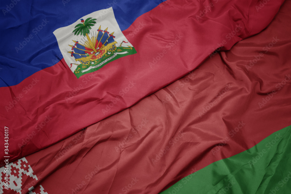 waving colorful flag of belarus and national flag of haiti. waving colorful flag of belarus and national flag of haiti.