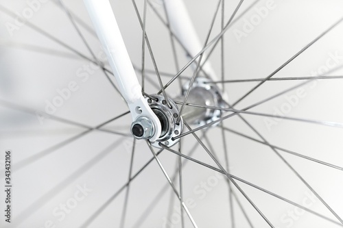 Bicycle wheel closeup front axle hub and fork photo