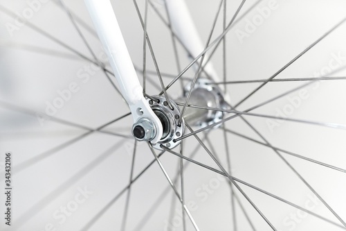Картината върху платно Bicycle wheel closeup front axle hub and fork