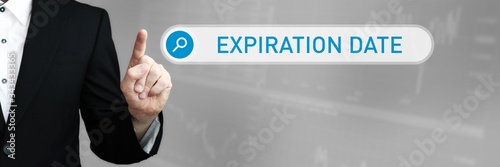 Expiration Date. Man in a suit points a finger at a search box. The word Expiration Date is in the search. Symbol for business, finance, statistics, analysis, economy
