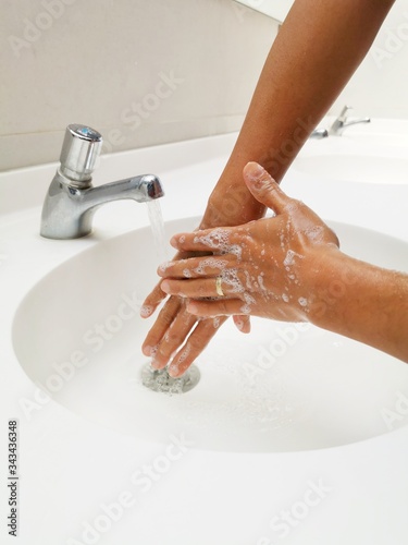 Washing hands rubbing with soap man for corona virus prevention, hygiene to stop spreading coronavirus.