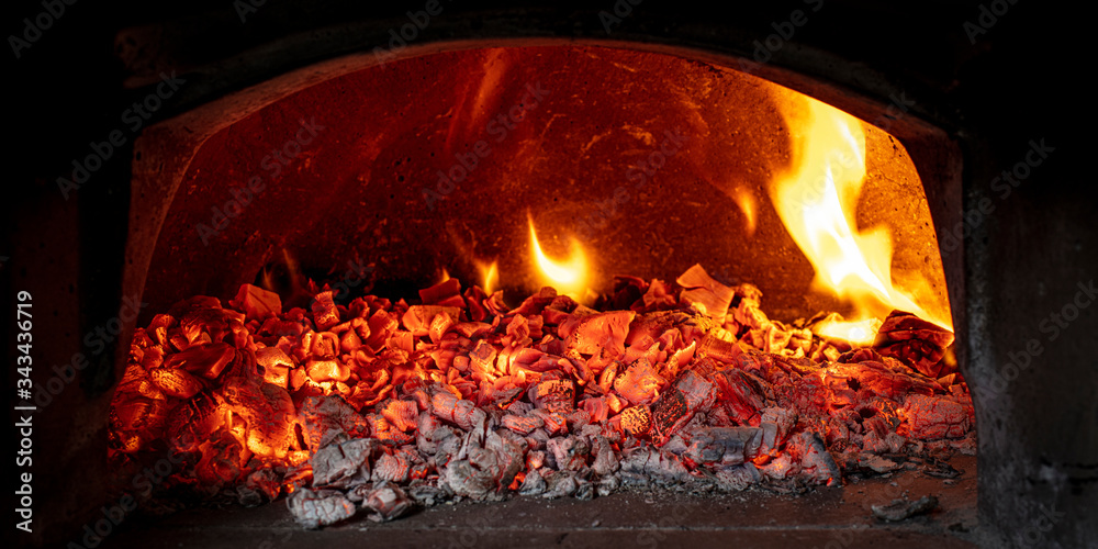 wood embers inside a wood-burning oven