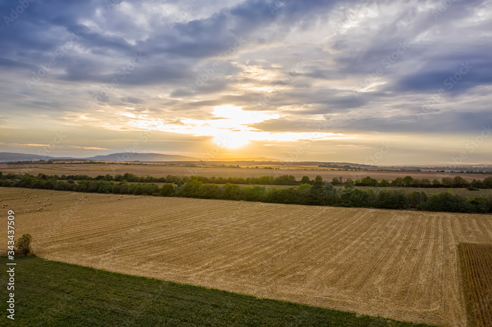 Aerial view from drone to agriculture field at sunset.
