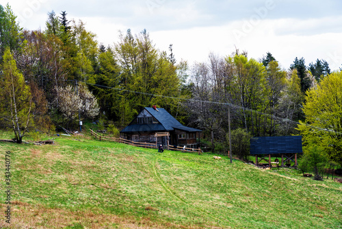 Fototapeta Naklejka Na Ścianę i Meble -  A traditional wooden house in Beskid Maly mountains, part of Carpathian mountain range. Poland