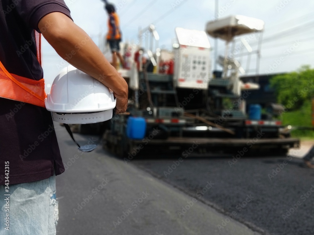 White hat and road construction (picture blurred)