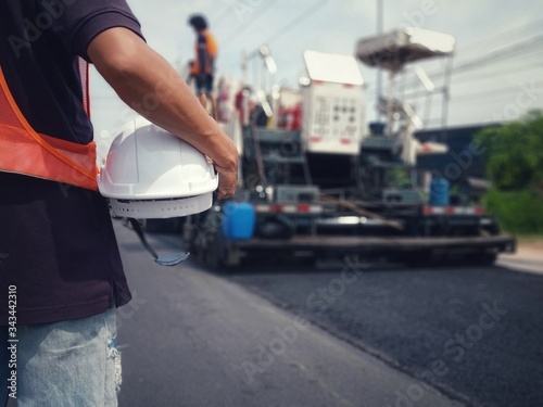 White hat and road construction (picture blurred)