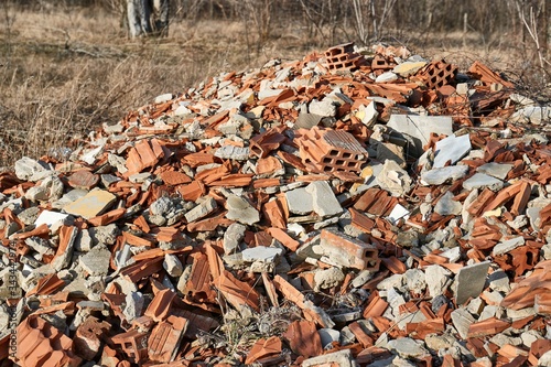 Pile of debris of a destroyed building, mostly tiles and bricks