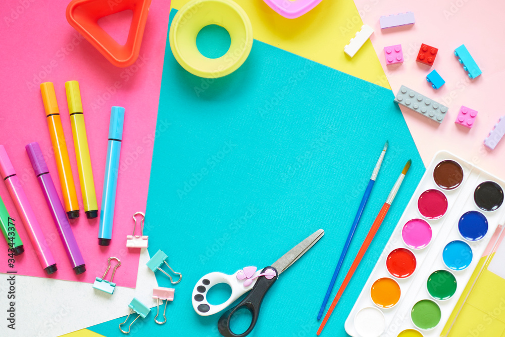 School supplies, stationery on yellow background - space for caption. Child ready to draw with pencils and make application of colored paper. Top view. School supplies, stationery on yellow background - space for caption. Child ready to draw with pencils and make application of colored paper. Top view.