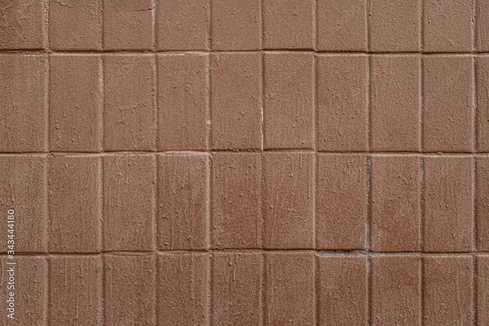 Fototapeta premium abstract background of an old tiled wall painted brown