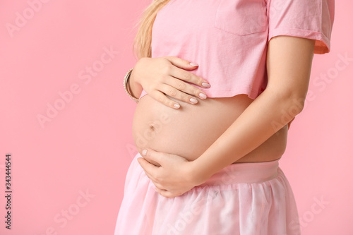 Wallpaper Mural Beautiful young pregnant woman on color background Torontodigital.ca