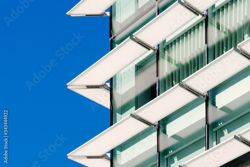 Architecture abstract background. Glass curtain walls with lattices elements. Facade detail Windows