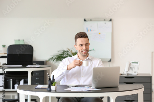 Smiling Businessman Drinkin...