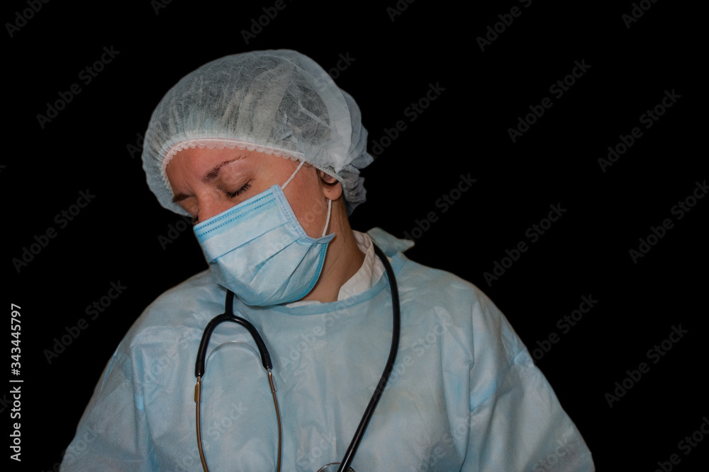 Isolated image of doctor or nurse sleep. COVID-19 pandemic. Tired, exhausted woman in uniform is sleeping in hospital or clinic after hard duty. Female with stethoscope around neck and closed eyes Isolated image of doctor or nurse sleep. COVID-19 pandemic. Tired, exhausted woman in uniform is sleeping in hospital or clinic after hard duty. Female with stethoscope around neck and closed eyes