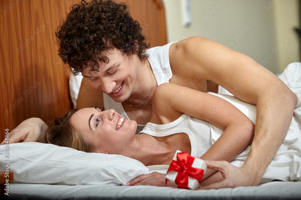 Happy young family with gift Happy young family with gift