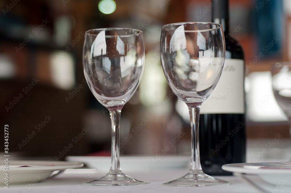 Restaurant table with crystal glasses and wine
Restaurant table with crystal glasses and wine