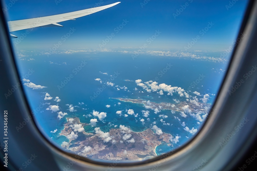 Saint Martin and Anguilla Caribbean Islands viewed from a plane window in flight