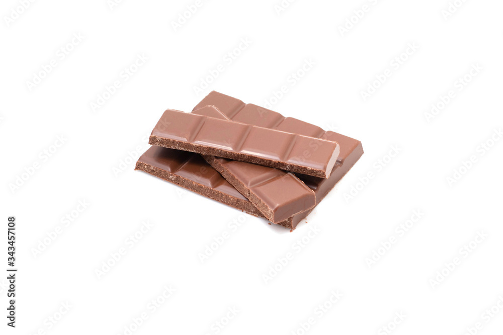 Pieces of chocolate on a white background, isolate. Broken chocolate bar