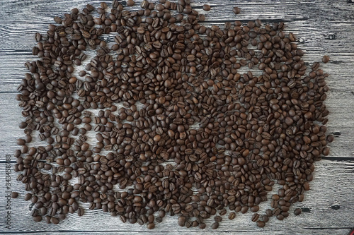 lots of coffee beans on a wooden table