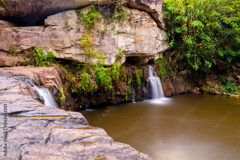 Landscape of flowing water fall on the rock/stone in dry season in south east Asia. Kulen Mountain park Landscape of flowing water fall on the rock/stone in dry season in south east Asia. Kulen Mountain park