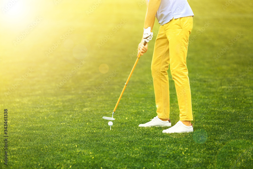 Fototapeta premium Man playing golf in park on sunny day. Space for design
