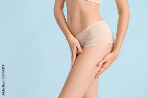 Slim woman on color background, closeup